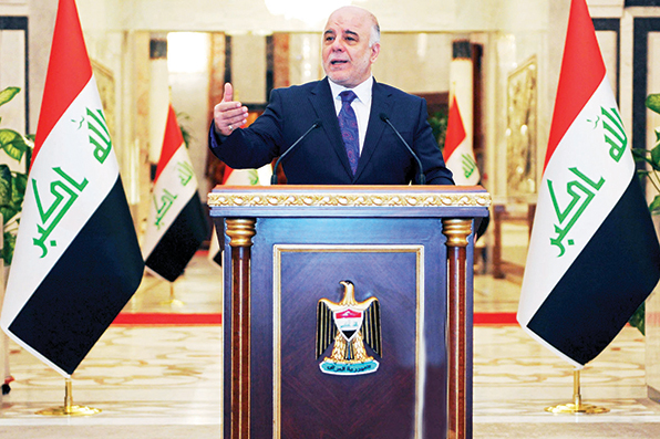 Iraqi premier-designate Haider al-Abadi speaks at his first press conference since accepting the nomination to be Iraq’s next prime minister, in Baghdad, Iraq, Monday, Aug. 25, 2014. Al-Abadi called on the country's numerous Shiite militias and tribes to come under government control and stop acting independently on Monday, as violence across the country killed over 40 people in areas where the Muslim sect dominates. Since early this year, Iraq has been facing a growing Sunni insurgency with the Islamic State group and allied Sunni militants who have taken over areas in the country's west and north. (AP Photo/Office of the Iraqi Prime Minister)