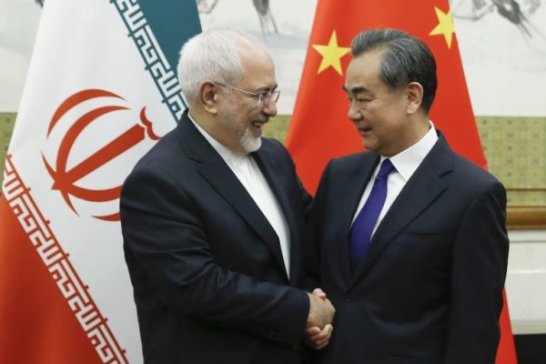 Chinese State Councillor and Foreign Minister Wang Yi (R) meets Iran's Foreign Minister Mohammad Javad Zarif at the Diaoyutai state guesthouse in Beijing on May 13, 2018.
Iran's foreign minister arrived May 13 in Beijing on the first leg of a whirlwind diplomatic tour designed to try and rescue the nuclear deal left on the brink of collapse after the US pulled out.    / AFP PHOTO / POOL / THOMAS PETER